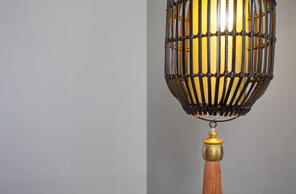 Handcrafted woven bamboo lantern with warm golden glow