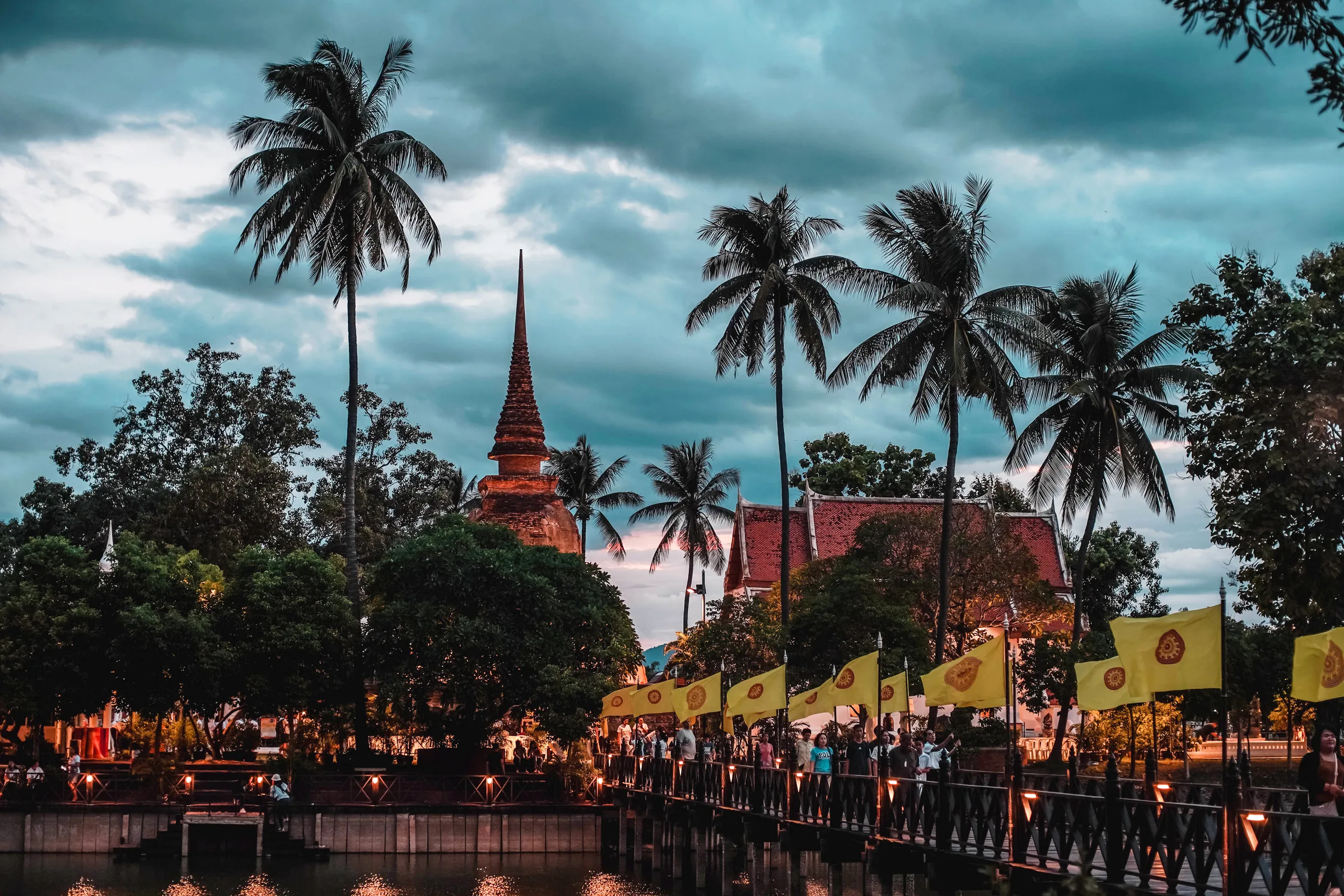 Monks in procession during the morning merit-making ceremony in Sukhothai at first light