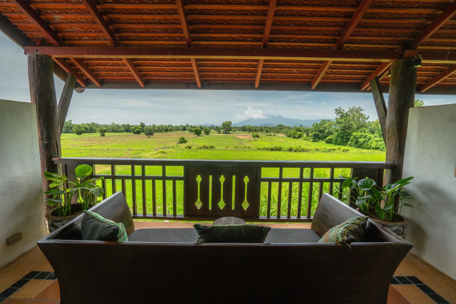 Deluxe Room private balcony with rice-field panorama